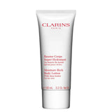 Clarins body lotion tube on a white background