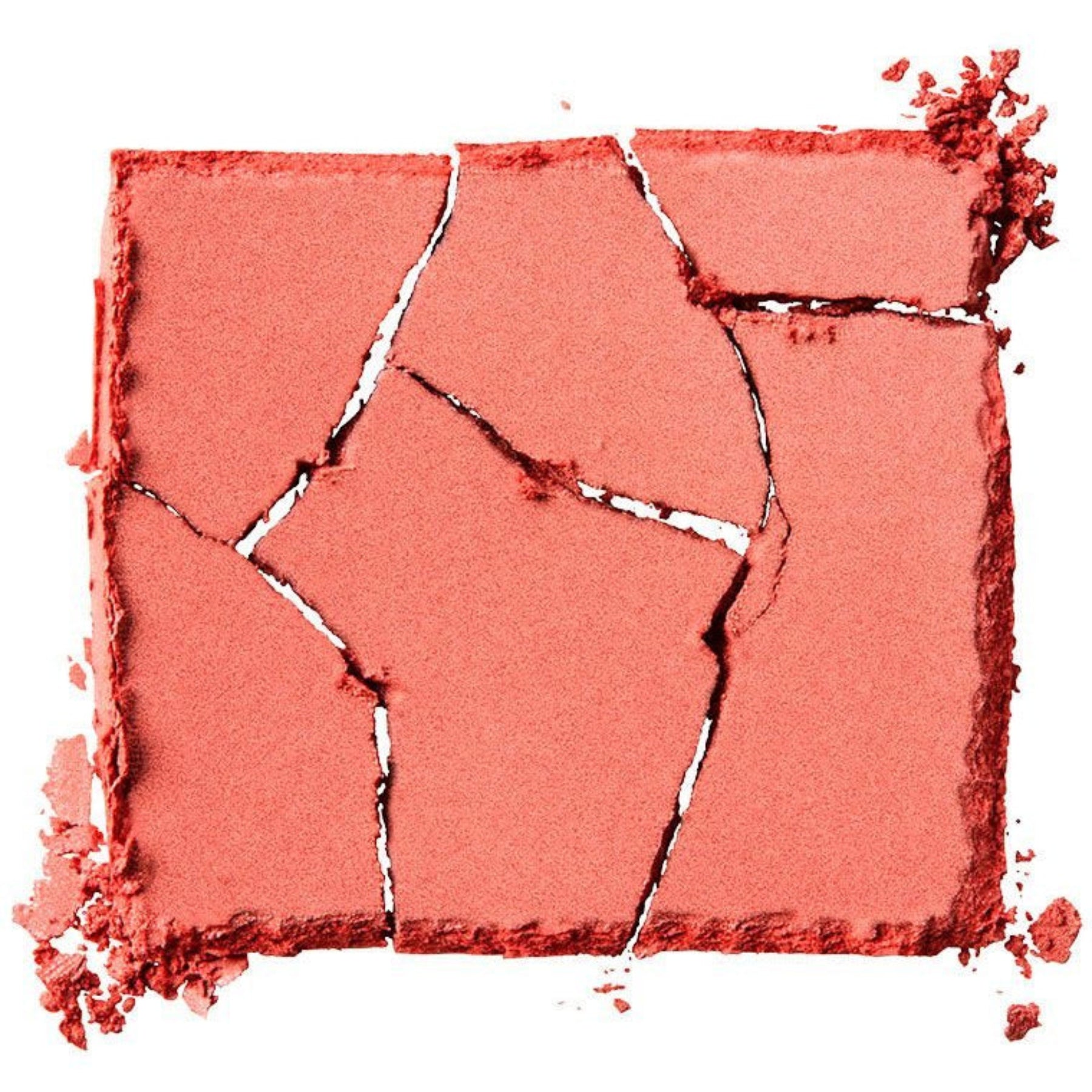 Crushed pink makeup powder on a white background